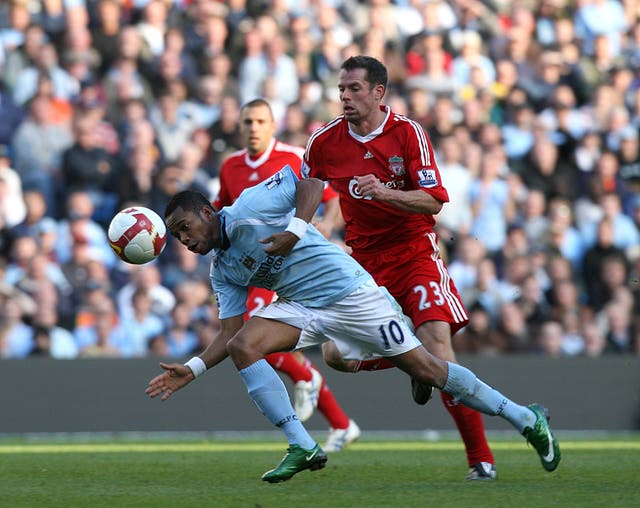 Jamie Carragher, right, tussles with Robinho