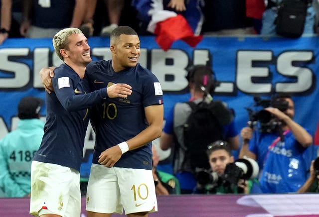 Mbappe (right) celebrates with France team-mate Antoine Griezmann (Jonathan Brady/PA).