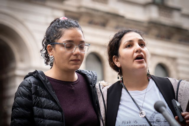 Sanaa, left, and Mona Seif, the sisters of pro-democracy activist Alaa Abd El-Fattah, speak to the media outside the Foreign, Commonwealth and Development Office in central London