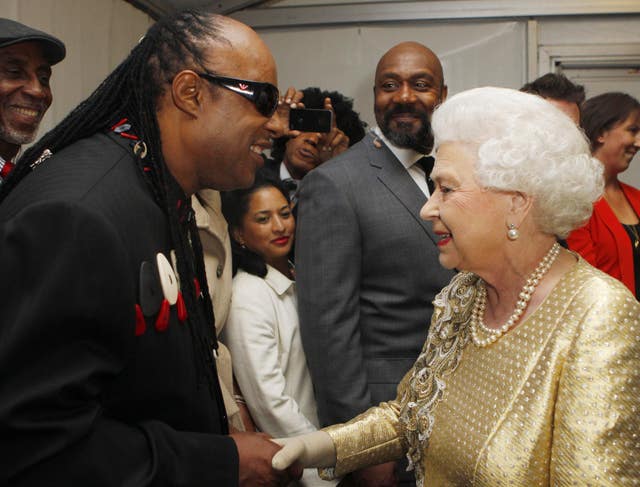 Stevie Wonder is introduced to the Queen backstage at the Diamond Jubilee Concert. Dave Thompson/PA Wire