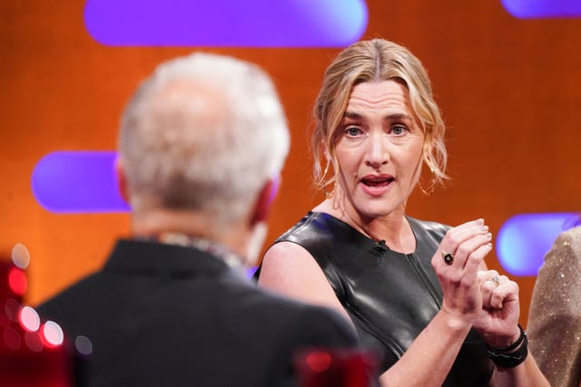 A view over Graham Norton's shoulder of Kate Winslet speaking to him on The Graham Norton Show