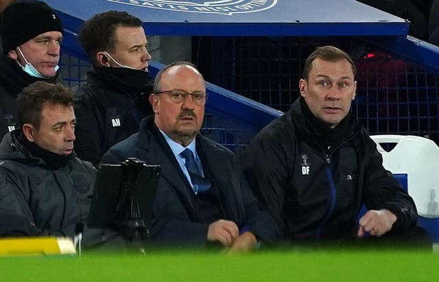Rafael Benitez (centre) is enduring a tough time at Everton
