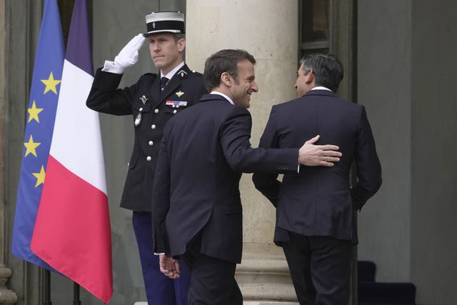 President Emmanuel Macron welcomes Rishi Sunak to the Elysee Palace
