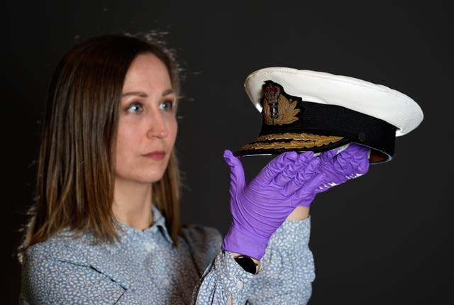 Kate Braun, at the National Museum of the Royal Navy, with an admiral’s cap belonging to the Duke of Edinburgh