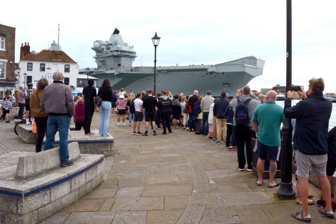 HMS Prince of Wales returns to Portsmouth Naval Base with fixed