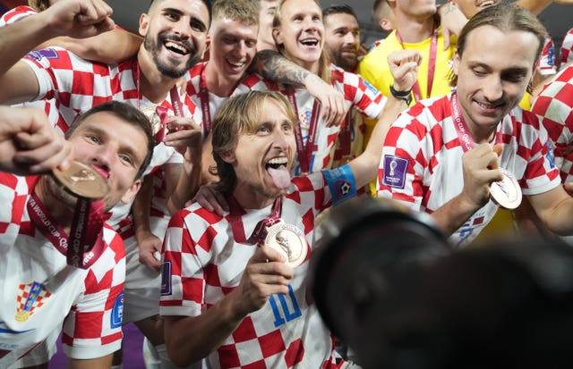 Modric (centre) celebrates with his Croatia team-mates (Adam Davy/PA).