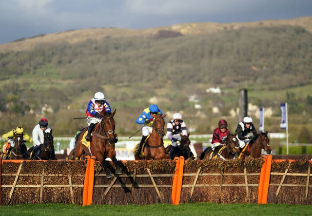 Love Envoi ridden by Jonathan Burke clears a fence before going on to win the Ryanair Mares’ Novices’ Hurdle during day three of the Cheltenham Festival in 2022