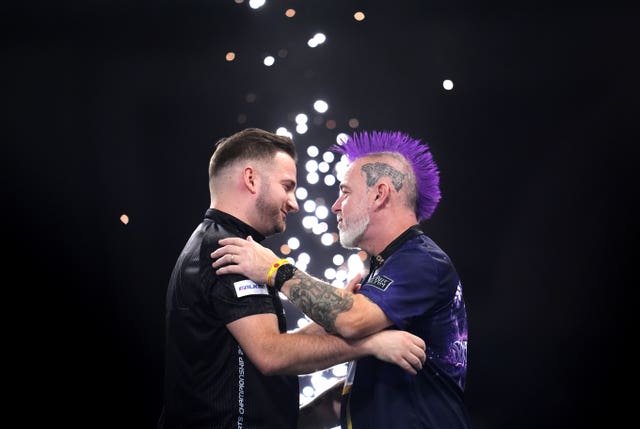 Peter Wright hugs Arno Merk
