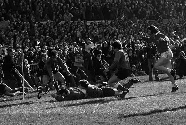 Phil Bennett (right, on the ground) scores a try for Wales against France in the Five Nations 