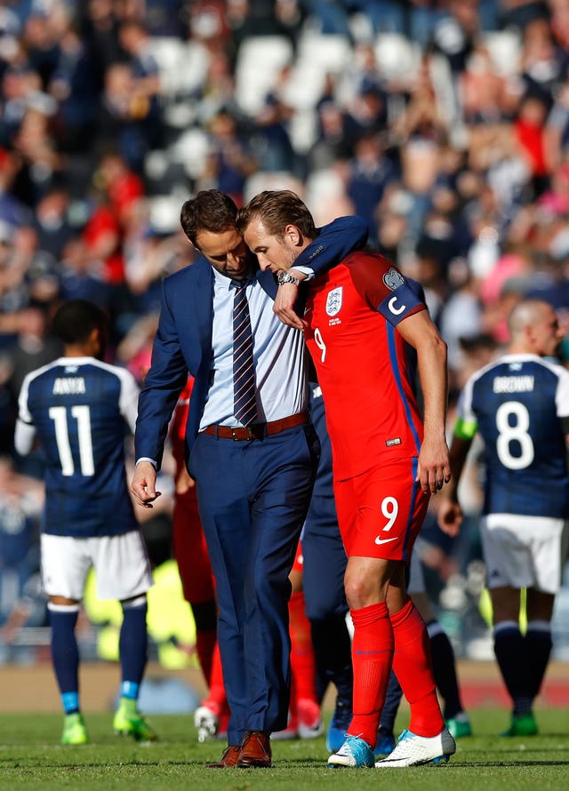 Southgate with Harry Kane after the striker scored an added-time equaliser as England avoided an embarrassing 2018 World Cup qualifying defeat against Scotland