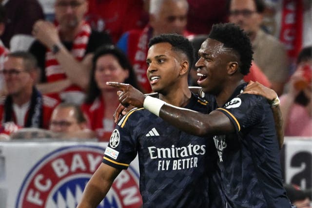 Vinicius Jr, right, celebrates with team-mate Rodrygo after his first goal