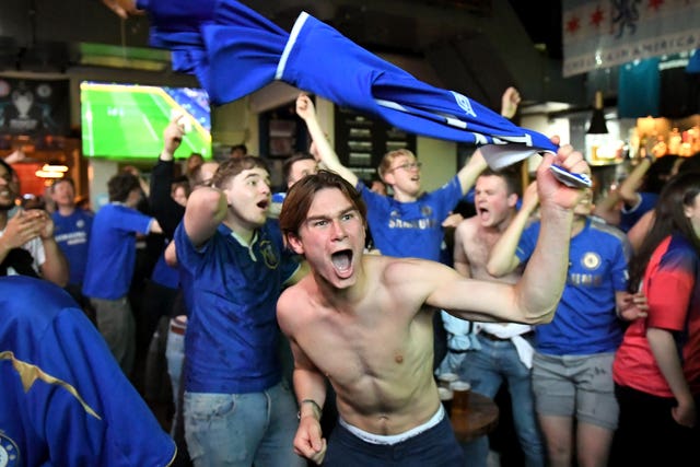 Chelsea fans celebrate the goal of the game at the Chelsea Pensioner pub in London