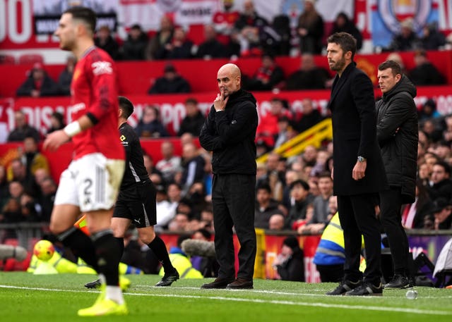 Pep Guardiola, centre, reacts on the touchline 