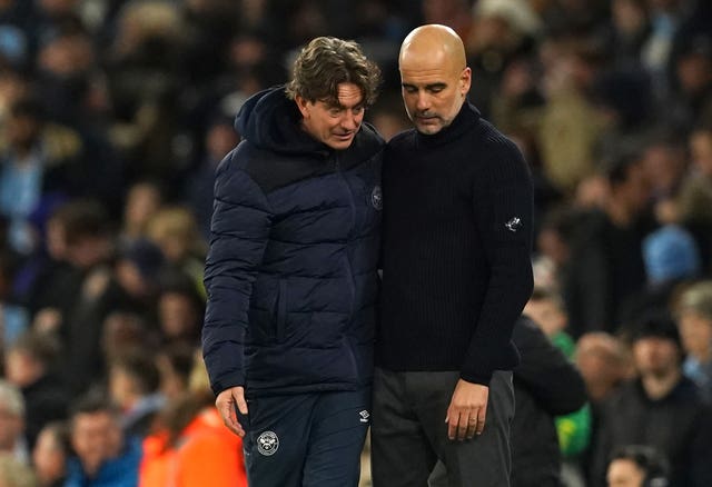 Brentford manager Thomas Frank, left, with Manchester City manager Pep Guardiola after the final whistle