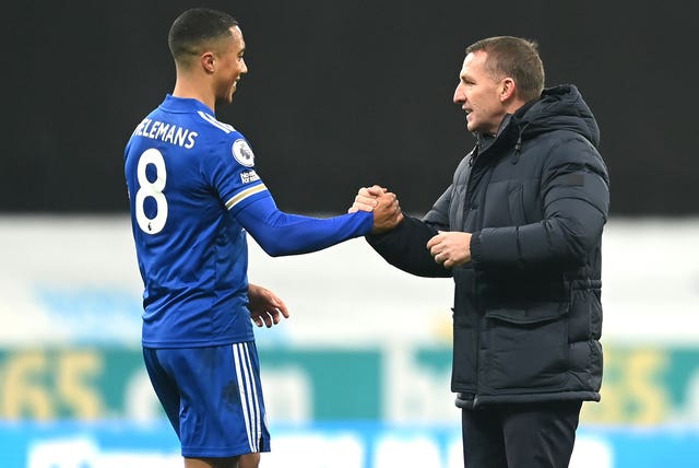 Youri Tielemans, left, and Brendan Rodgers celebrate Leicester's 2-1 win at Newcastle