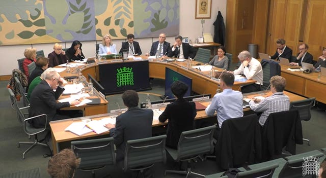 Chancellor of the Exchequer Jeremy Hunt (front, second right) giving evidence before the Treasury Committee at the House of Commons, in London
