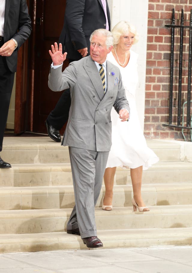 The Prince of Wales, with the Duchess of Cornwall, leaves the Lindo Wing of St Mary’s Hospital after visiting his new grandson, Prince George in 2013. (Yui Mok/PA)