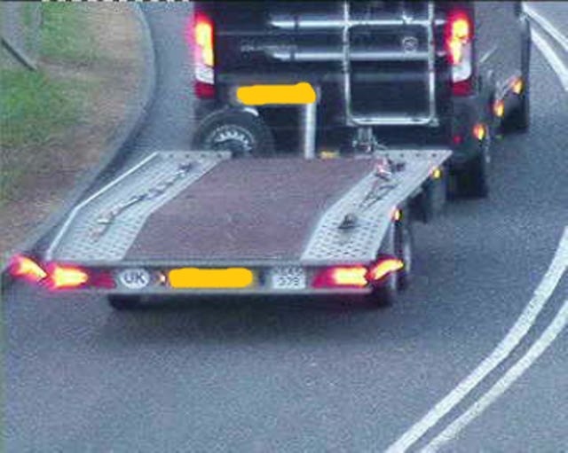 A specially adapted car pulling a trailer which had been converted to include a hide so drugs could be stored in it undetected