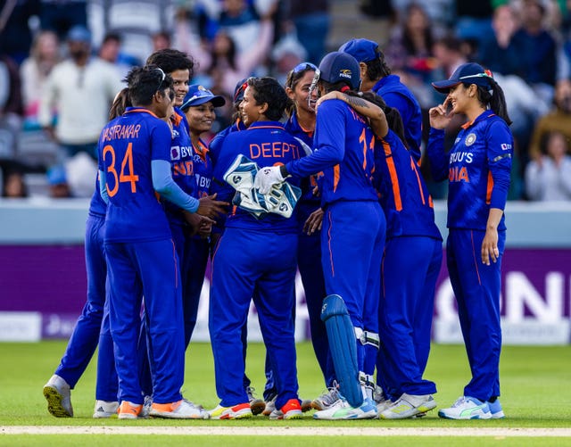 Deepti Sharma, centre, takes the congratulations after India's win