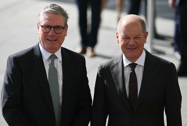 German chancellor Olaf Scholz stands next to Prime Minister Sir Keir Starmer