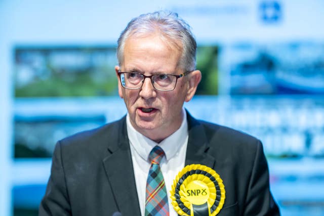 Seamus Logan speaks at a press conference