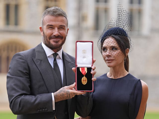 David Beckham and his wife Victoria pictured at his investiture in 2025