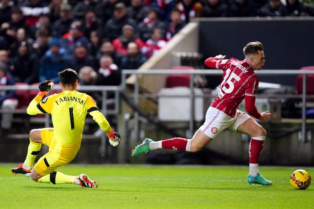 Tommy Conway, right, goes round goalkeeper Lukasz Fabianski before scoring Bristol City''s winner