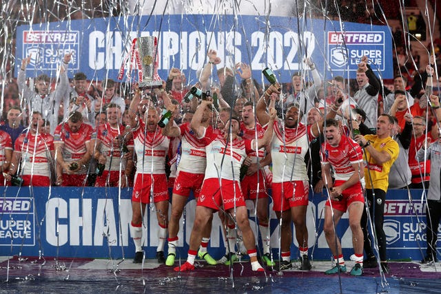 St Helens players and staff celebrate winning the Grand Final