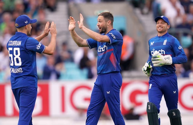 Chris Woakes (centre) feels buoyed by Ben Stokes' presence in the side.