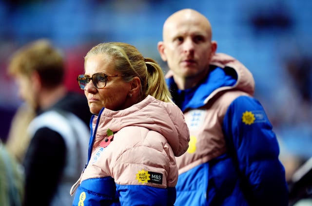 Sarina Wiegman watches on from the touchline during England's win over South Africa