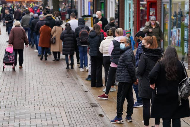 Hundreds of people queue at a vaccination centre on Solihull High Street, West Midlands (Jacob King/PA)