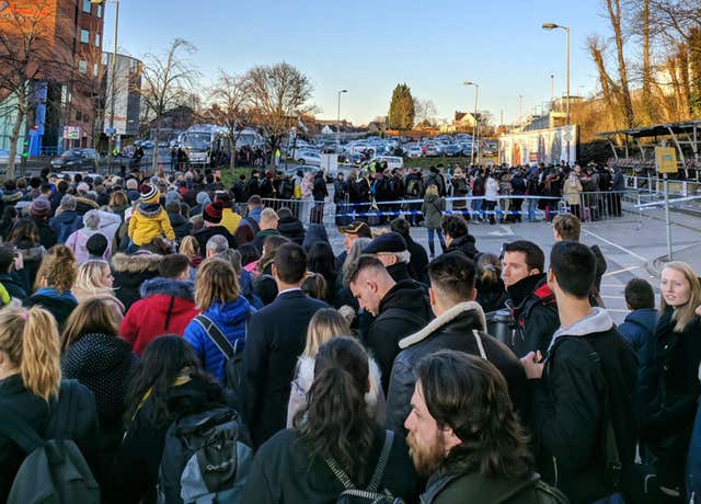 Southern Rail users say they have missed flights as an overcrowded rail replacement service caused crowds to bottleneck at Redhill station (Dylan Myers/PA)