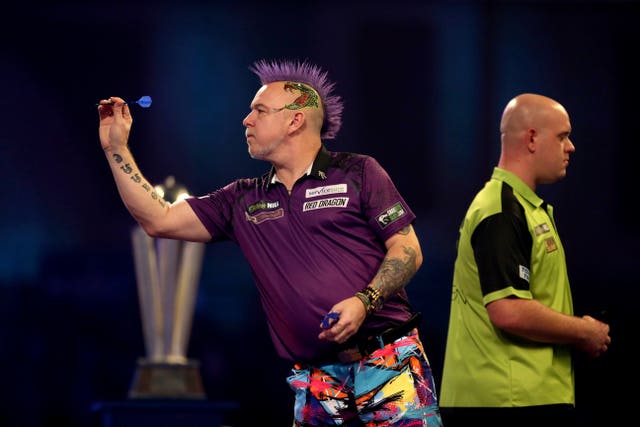 Van Gerwen (right) had no answer to Wright