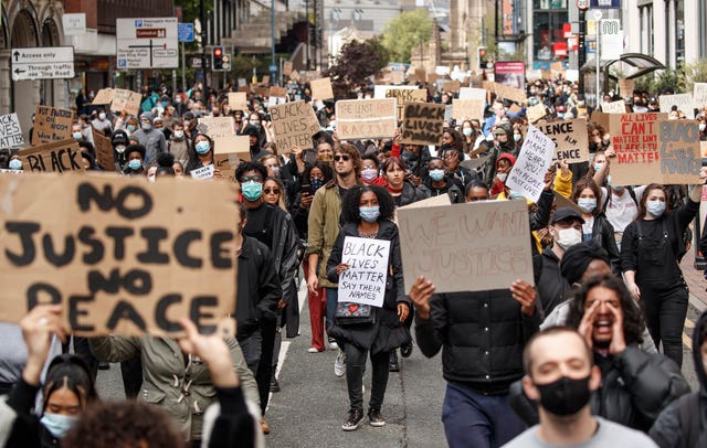 Protesters march in Manchester