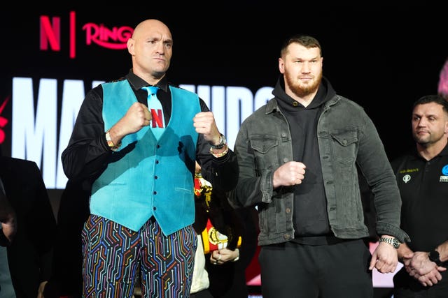 Tyson Fury (left) and Arslanbek Makhmudov face off during a press conference at the Tottenham Hotspur Stadium