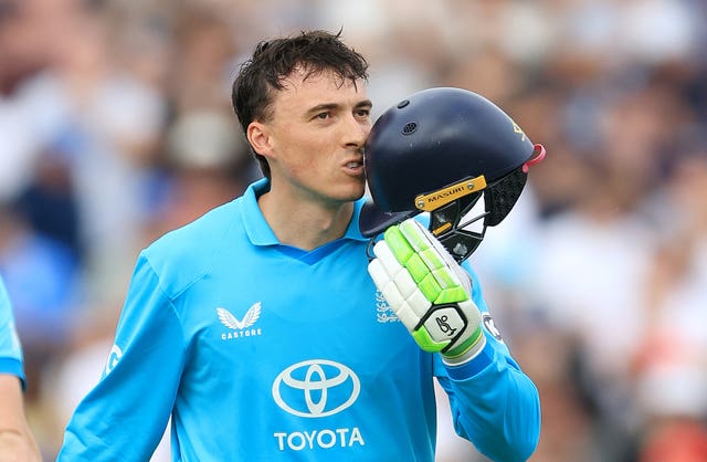 Tom Banton kisses the badge on his England helmet