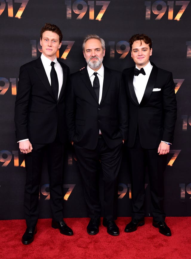 Sir Sam Mendes with the stars of 1917, George MacKay (left) and Dean-Charles Chapman