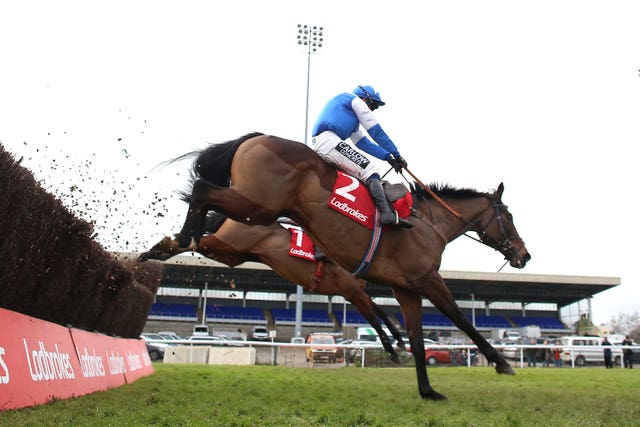 Boothill ridden by jockey J J Burke on their way to winning the Ladbrokes Wayward Lad Novices’ Chase during day two of the Ladbrokes Christmas Festival at Kempton Racecourse