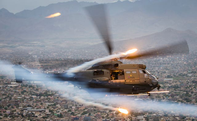 An RAF Puma HC2 flies over Kabul