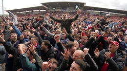 Wrexham fans celebrate their promotion (Jacob King/PA).