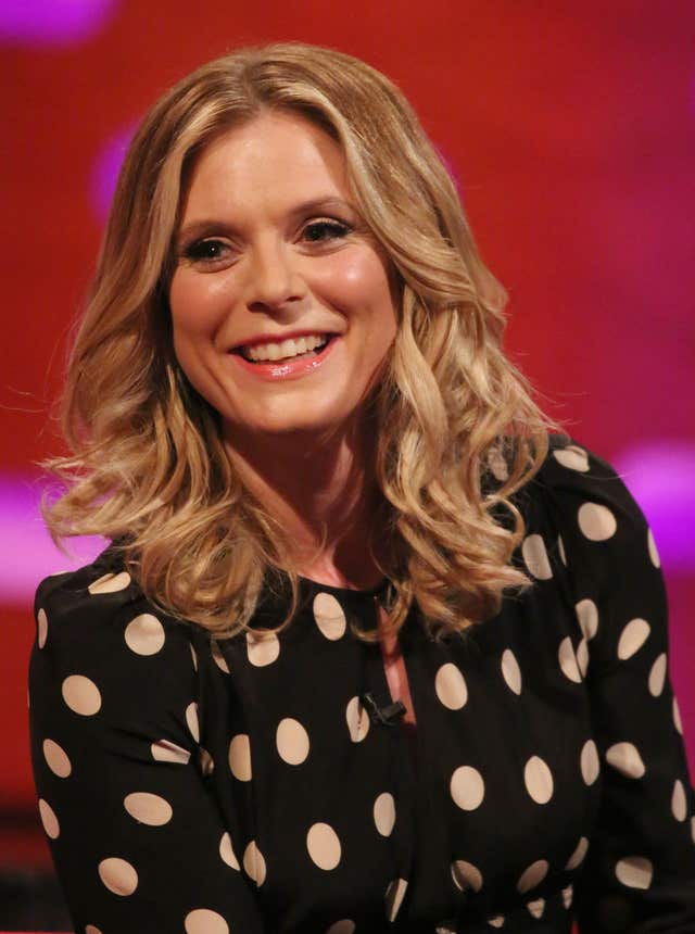 A close-up of a smiling Emilia Fox