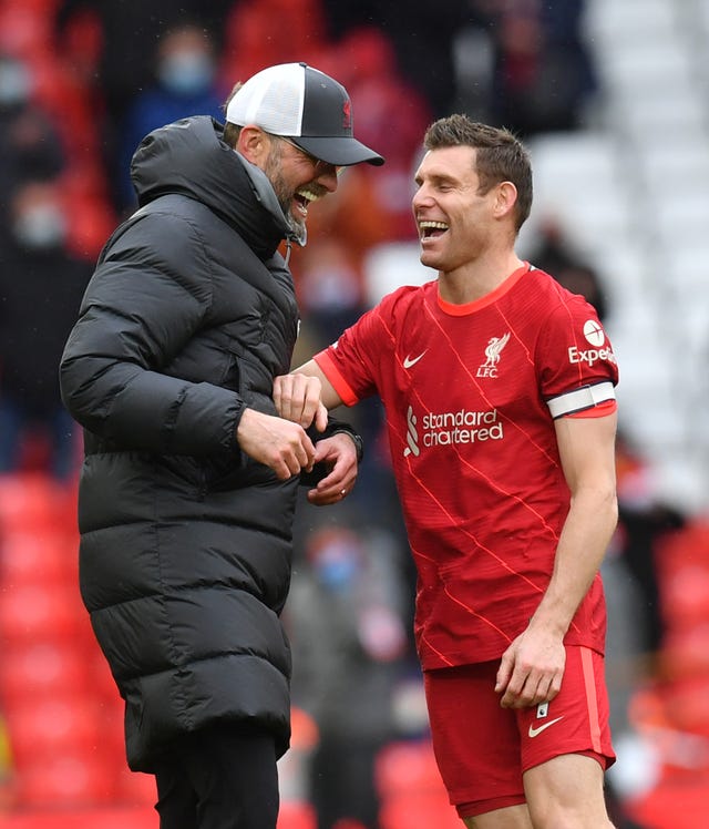 Liverpool manager Jurgen Klopp shares a joke with James Milner