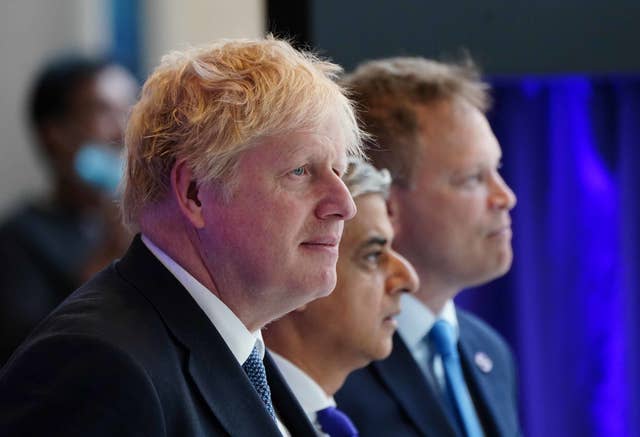 Boris Johnson, Mayor of London Sadiq Khan and then-transport secretary Grant Shapps (Ian West/PA)