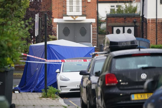 A blue forensic tent has been put up in Kirstall Gardens as police gather evidence.