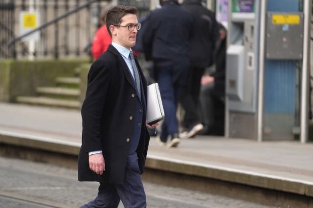 Isaac Burke, the brother of Enoch Burke, leaves the High Court, Dublin
