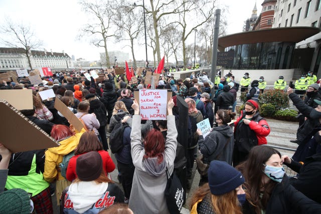 A crowd holding placards outside New Scotland Yard in London (Yui Mok/PA)