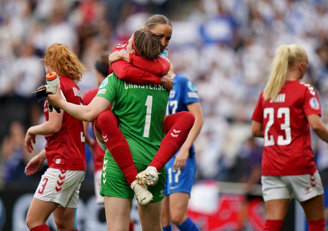 Denmark's Sanne Troelsgaard Nielsen, top, and Lene Christensen celebrate victory over Finland