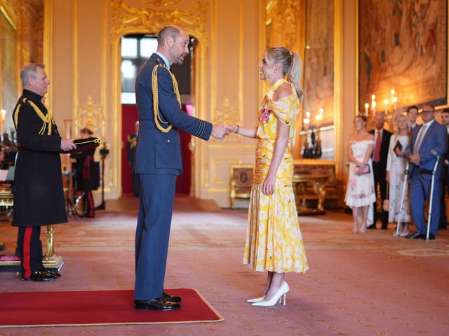 Keely Hodgkinson shakes hands with the Prince of Wales