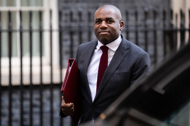 Foreign Secretary David Lammy holding a file