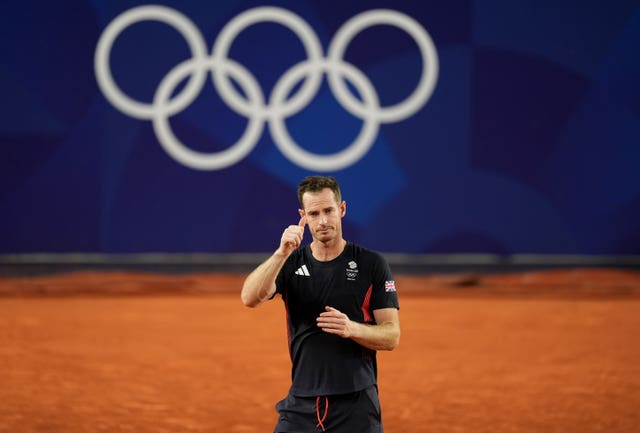 An emotional Sir Andy Murray puts his thumb up after his career ends at the Paris Olympics